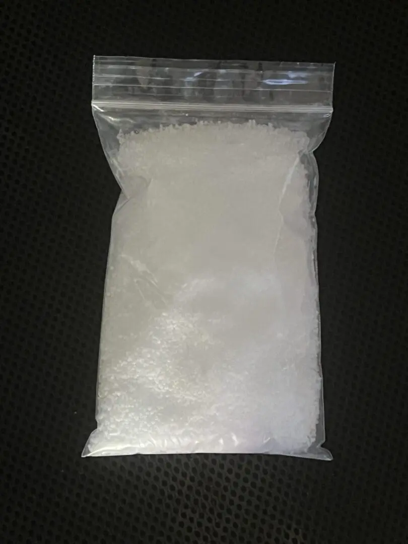 A bag of white substance on top of a table.