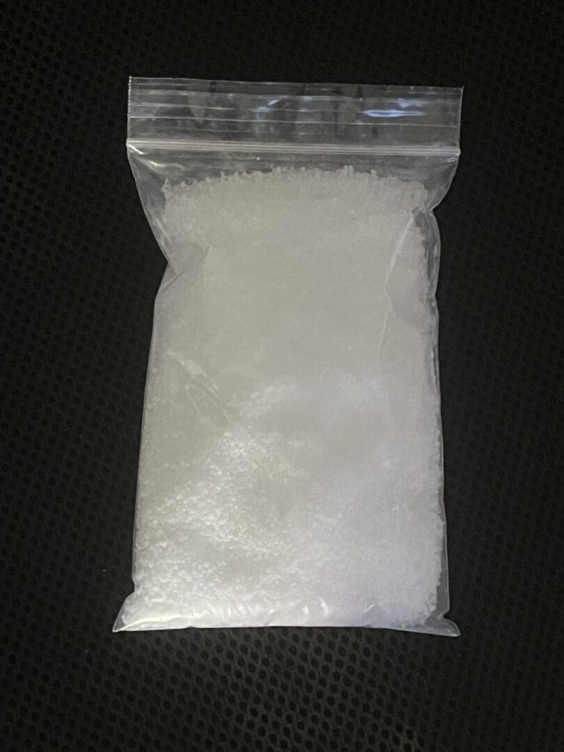 A bag of white substance on top of a table.