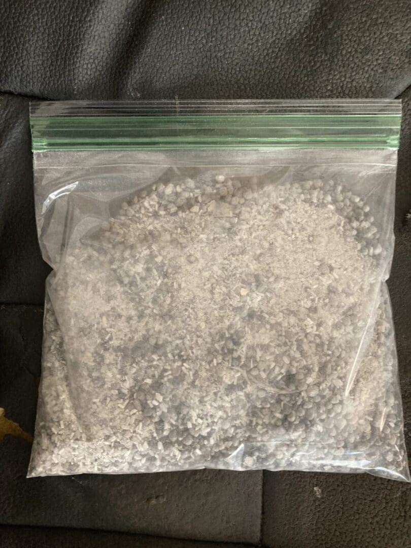 A bag of white stuff sitting on top of a table.